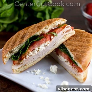 mediterranean turkey panini 2.jpg Mediterranean Turkey Panini, sliced diagonally, showing layers of ingredients