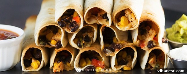 Crispy Baked Chicken Flautas with golden tortillas and savory chicken and cheese filling, garnished with fresh cilantro.