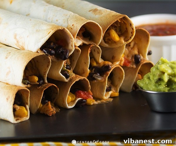 A bowl filled with the vibrant, savory chicken and cheese flauta filling, showcasing colorful vegetables and shredded chicken, ready for assembly.