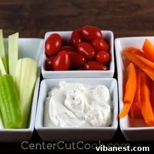 bowls of fresh vegetables and a bowl of classic ranch dip