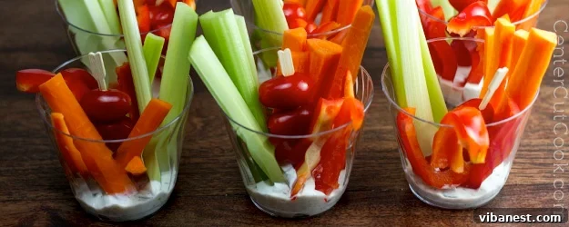 Delicious Veggie Cups Party Appetizer Beautifully arranged veggie cups with ranch dip, ready for a party.