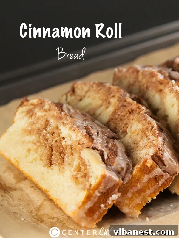 Homemade Cinnamon Roll Bread Freshly baked Cinnamon Roll Bread with a sweet glaze drizzle, sliced and ready to serve