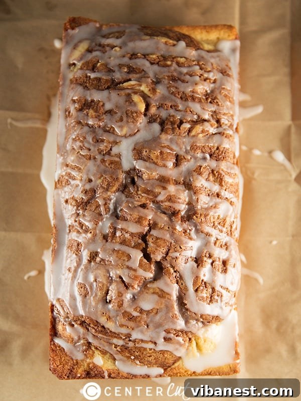 Cinnamon Roll Bread Slice A slice of Cinnamon Roll Bread showing the perfect texture and glaze