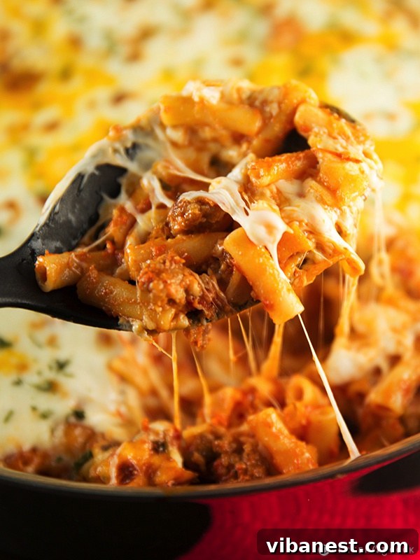 Skillet baked ziti served in a bowl Generous serving of Skillet Baked Ziti in a bowl with fresh basil garnish