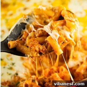 A delicious one-pot baked ziti with melted cheese in a skillet