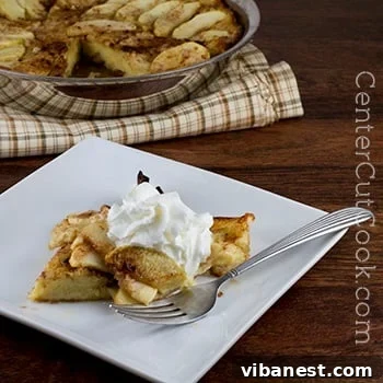 German Apple Pancake with Whipped Cream German apple pancake close-up with whipped cream