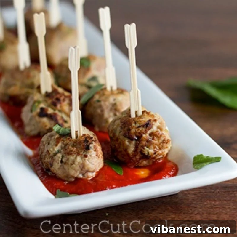 Tender Ricotta Turkey Meatballs 2 Beautifully browned turkey ricotta meatballs on a plate, ready to be served.