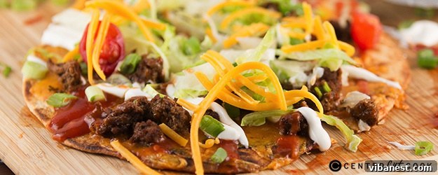 Delicious Taco Flatbread Pizza with fresh toppings, ready to be enjoyed