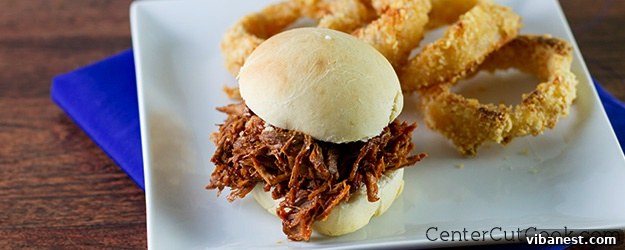 Slow cooker pulled pork.jpg Close-up of freshly shredded slow cooker pulled pork, coated in BBQ sauce, ready for serving.