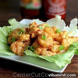 bang bang shrimp on a piece of lettuce
