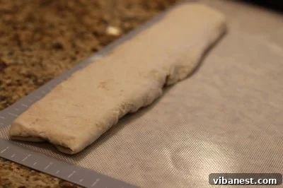 Deep Dish Pizza Dough Log Dough being rolled into a log
