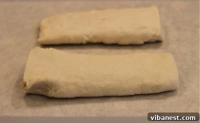 Deep Dish Pizza Dough Divided Dough log cut into two pieces