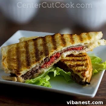 Grilled Havarti and roast beef panini, sliced diagonally.