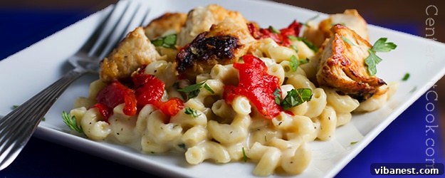 Creamy Herbed Havarti Macaroni and Cheese with Chicken and Roasted Red Peppers, a perfect comfort food dish.