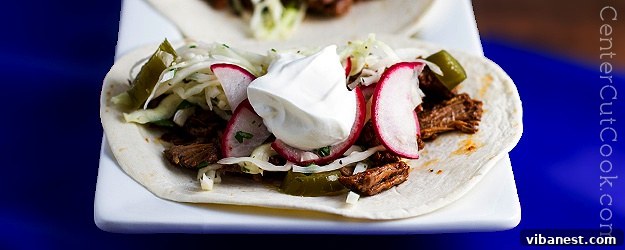 Delicious slow cooker shredded beef tacos with fresh toppings