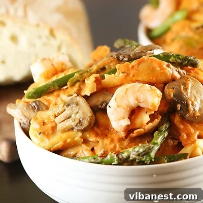 Plated tortellini with shrimp and mushrooms, ready to eat