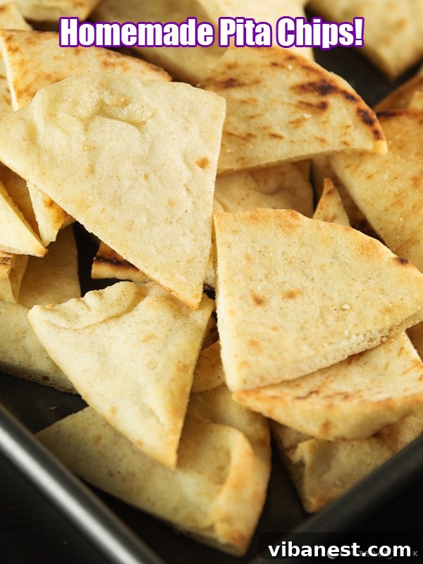 Pita Chips Ready to Serve Close-up shot of perfectly baked pita chips showing their crispy texture and golden color.