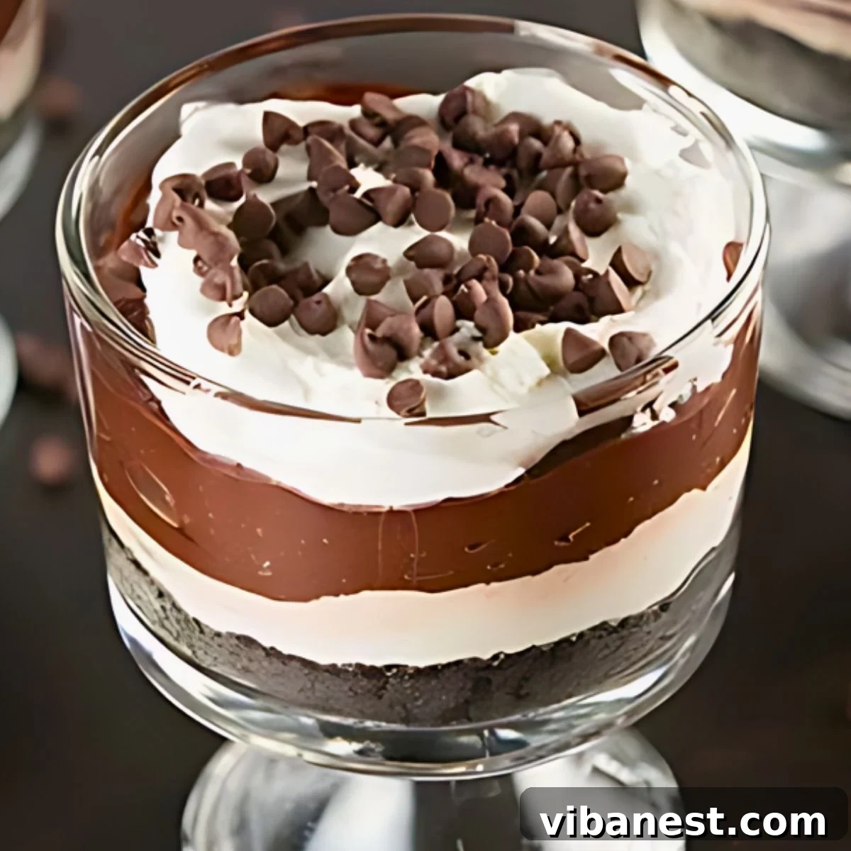 Luscious Chocolate Pudding Parfaits 2 Delicious no-bake easy chocolate pudding parfaits layered in clear glasses with Oreo crumbs on top
