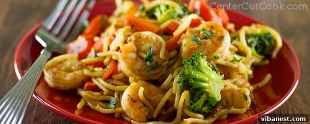 Vibrant and spicy shrimp stir-fry in a pan, ready to serve