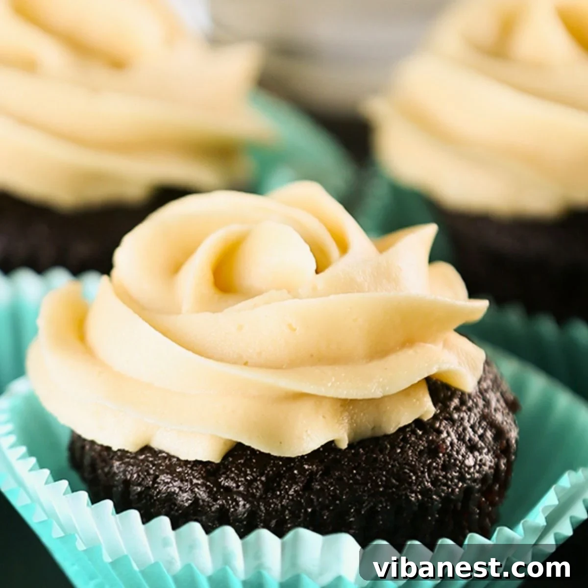 Peanut Butter Cup Cupcakes 2 Irresistible chocolate cupcakes generously topped with fluffy peanut butter frosting, showcasing their homemade perfection.
