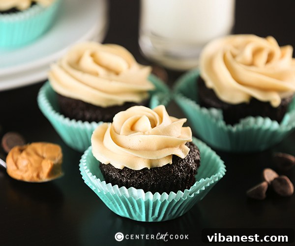 chocolate peanut butter cupcakes 3 A close-up view of a single chocolate cupcake, perfectly baked and cooling in its paper liner.