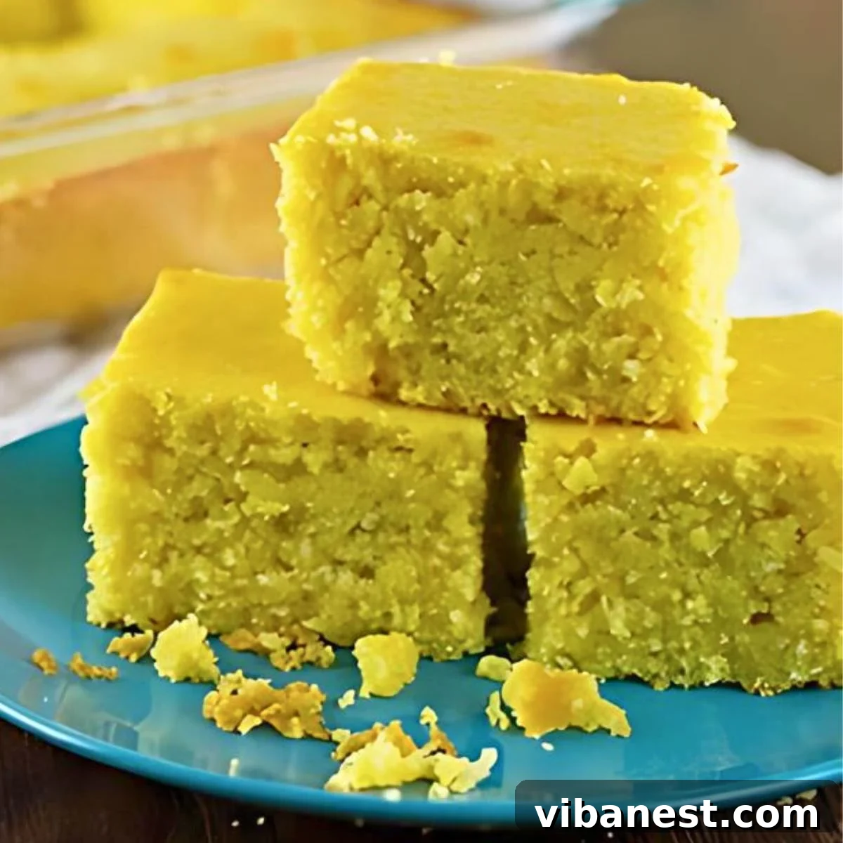 Hearty Homestyle Cornbread 2 Old-fashioned corn bread with a golden-brown crust and a crumbly interior, ready to be served.