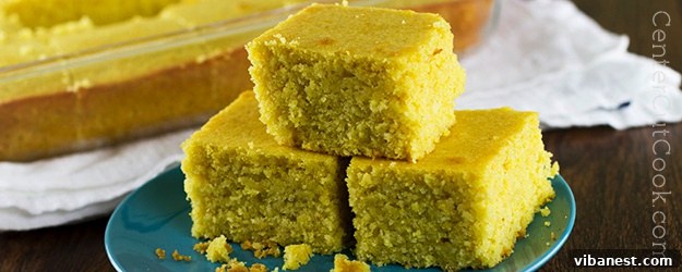 corn bread.jpg Close-up of freshly baked golden corn bread slices on a wooden board.