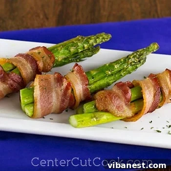 Close-up of perfectly baked bacon-wrapped asparagus with golden bacon and green spears
