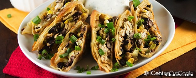 Crispy Baked Southwestern Egg Rolls served with fresh cilantro and lime wedges
