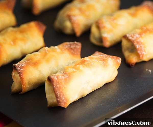 Sliced Baked Southwestern Egg Rolls Sliced baked southwestern egg rolls showing the rich filling, ready for dipping