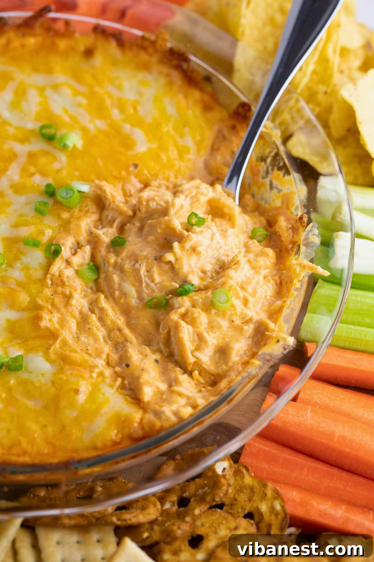 Ultimate Tangy Chicken Dip 2 easy buffalo chicken dip recipe served warm with dippers