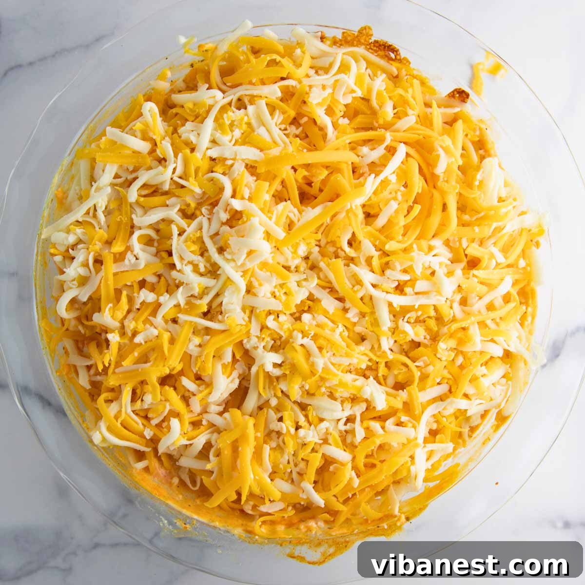 Ultimate Tangy Chicken Dip 9 buffalo chicken dip topped with more cheese