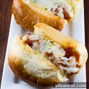 close-up of garlic bread meatball subs with melted cheese