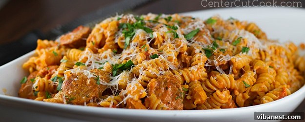 Italian Chicken Sausage Pasta.jpg Close-up of creamy Italian Chicken Sausage Pasta garnished with fresh herbs and cheese.