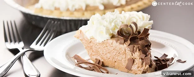 Decadent French Silk Pie with chocolate shavings and whipped cream
