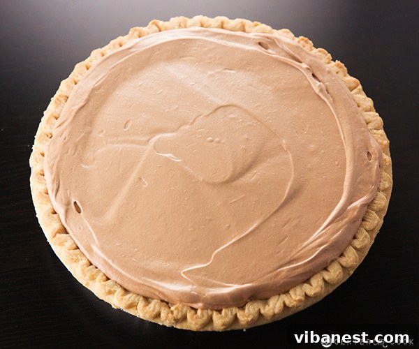 Spreading French Silk Pie Filling French Silk Pie filling being spread into a pre-baked pie crust