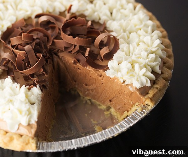 Adding Chocolate Curls to French Silk Pie Hand sprinkling chocolate curls onto the finished French Silk Pie