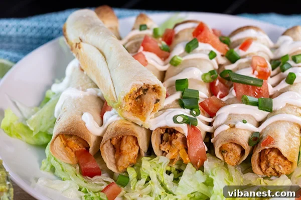 Lean and Luscious Taquito Rolls 6 Freshly baked crispy taquitos on a wire rack, ready to be served.