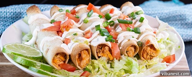 Lean and Luscious Taquito Rolls 8 A final close-up of oven-baked creamy chicken taquitos, perfectly golden and garnished.