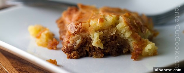 Perfectly baked Chess Cake, golden brown with a creamy top layer and chewy cake mix crust, ready to be sliced and served for any occasion.