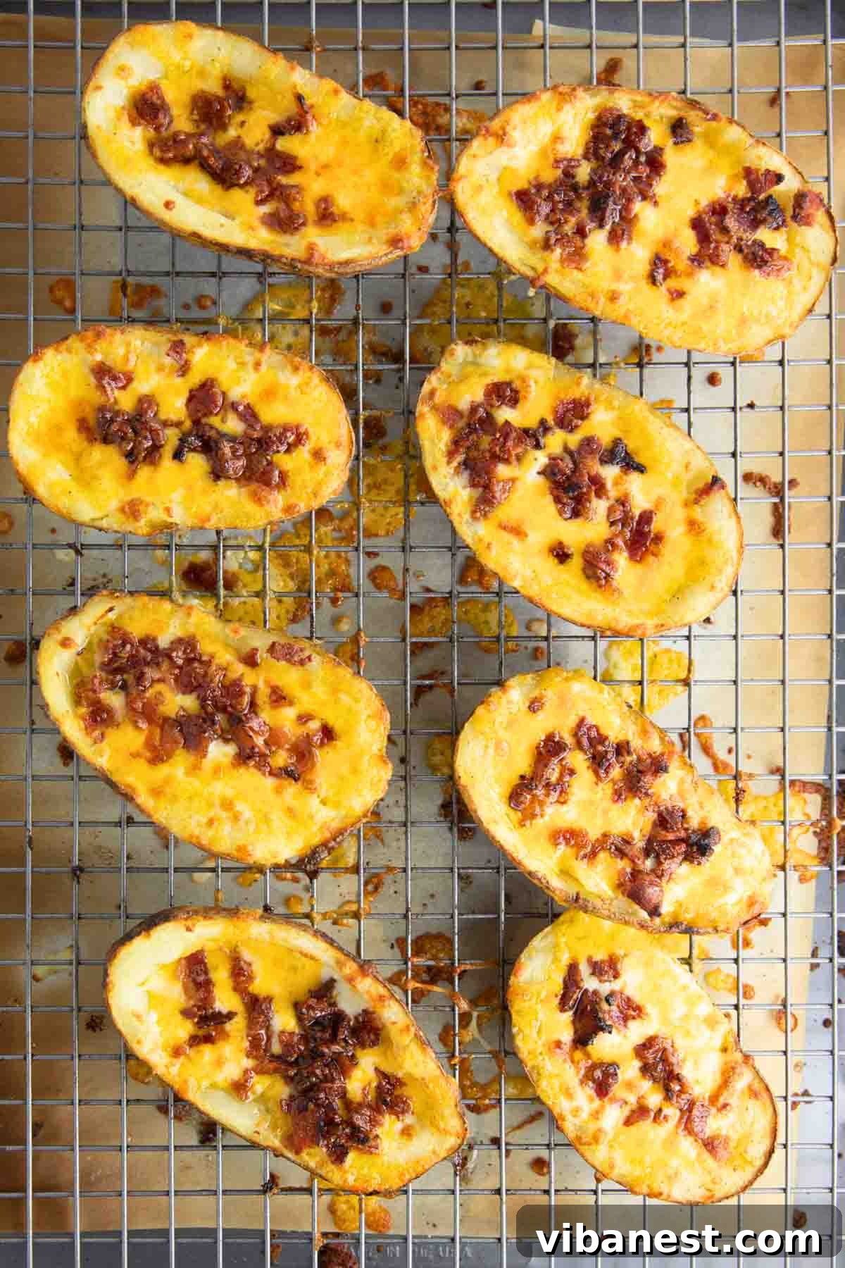 Fully Loaded Potato Boats 11 Finished potato skins, hot and bubbly, with perfectly melted cheddar cheese and golden-brown bacon after a quick broil.