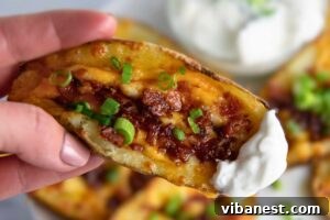 Fully Loaded Potato Boats 4 A close-up of a potato skin, showing its golden-brown, crispy texture after being broiled.