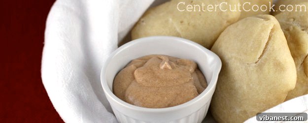 Delicious Cinnamon Honey Butter Homemade cinnamon butter spread on a fresh roll