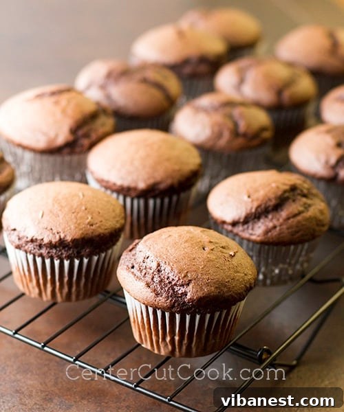 Euphoria Cupcakes 3 Poking holes in baked chocolate cupcakes for filling