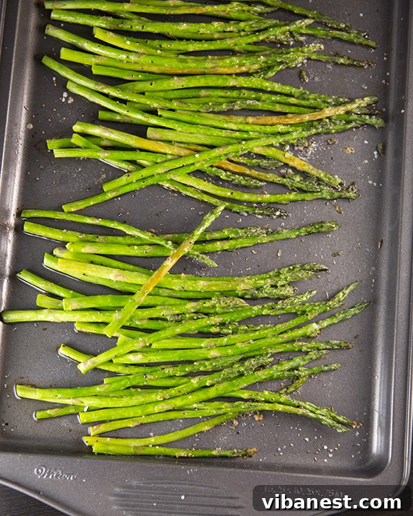 Roasted Asparagus Perfection Perfectly roasted asparagus spears arranged on a baking sheet, ready to be served.