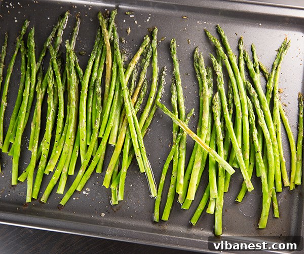 Roasted Asparagus Side Dish Plated roasted asparagus served next to a main course, showcasing its role as an elegant side.
