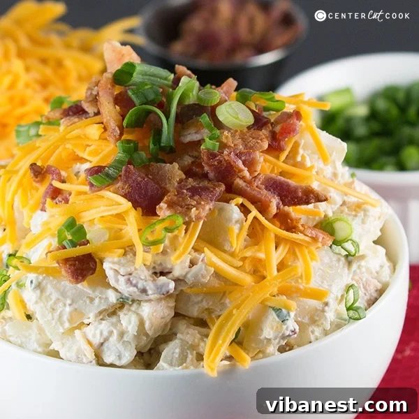 loaded baked potato salad fb.jpg Loaded Baked Potato Salad in a pristine white serving bowl, garnished and ready