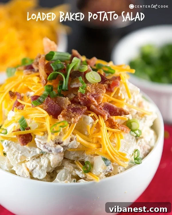 loaded baked potato salad 7.jpg Overhead view of a large bowl of Loaded Baked Potato Salad, beautifully garnished