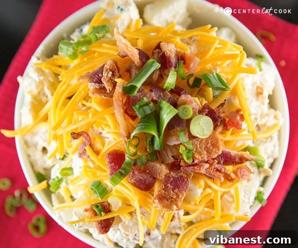 loaded baked potato salad 6.jpg Close-up of the delightful, creamy texture of Loaded Baked Potato Salad, ready to serve