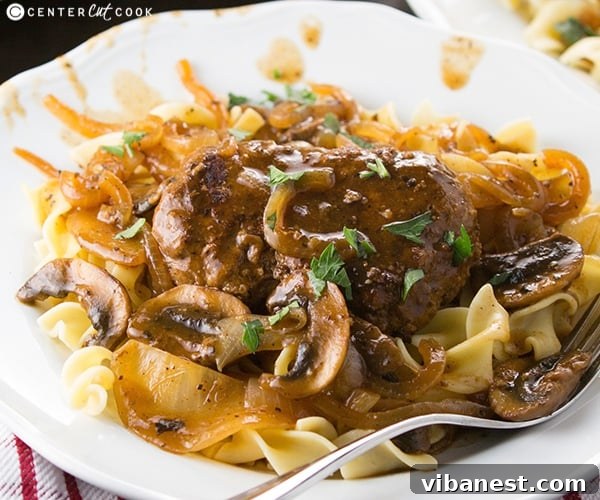 salisbury steak 4.jpg Salisbury steak served over buttered noodles